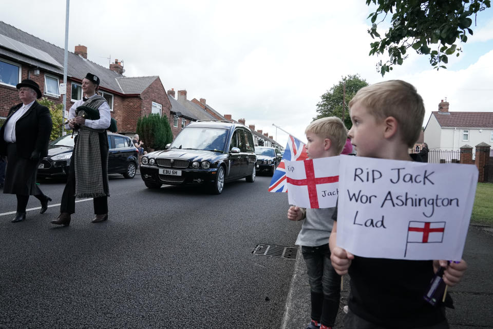 People line the streets as the funeral cortege of Jack Charlton passes through his hometown of Ashington, in Northumberland ahead of his funeral service at West Road Crematorium, in Newcastle. The former Republic of Ireland manager, who won the World Cup, playing for England, died on July 10 aged 85.