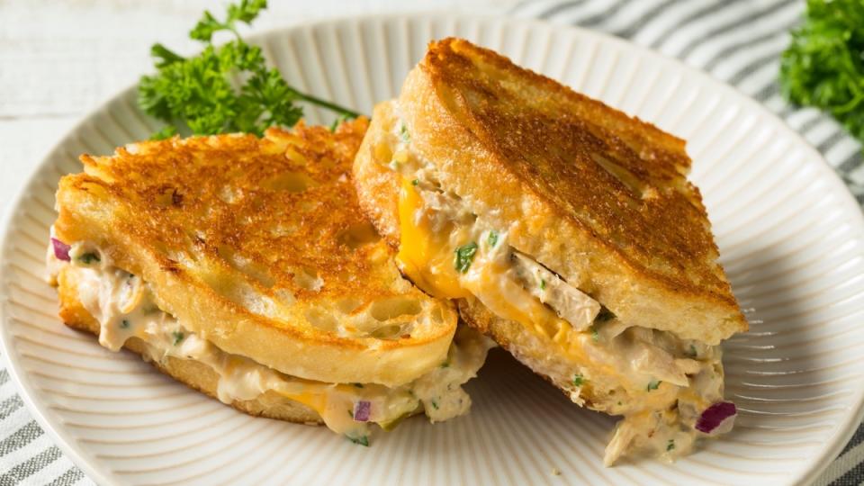Tuna melt sandwich on a white plate to help fight hot flashes