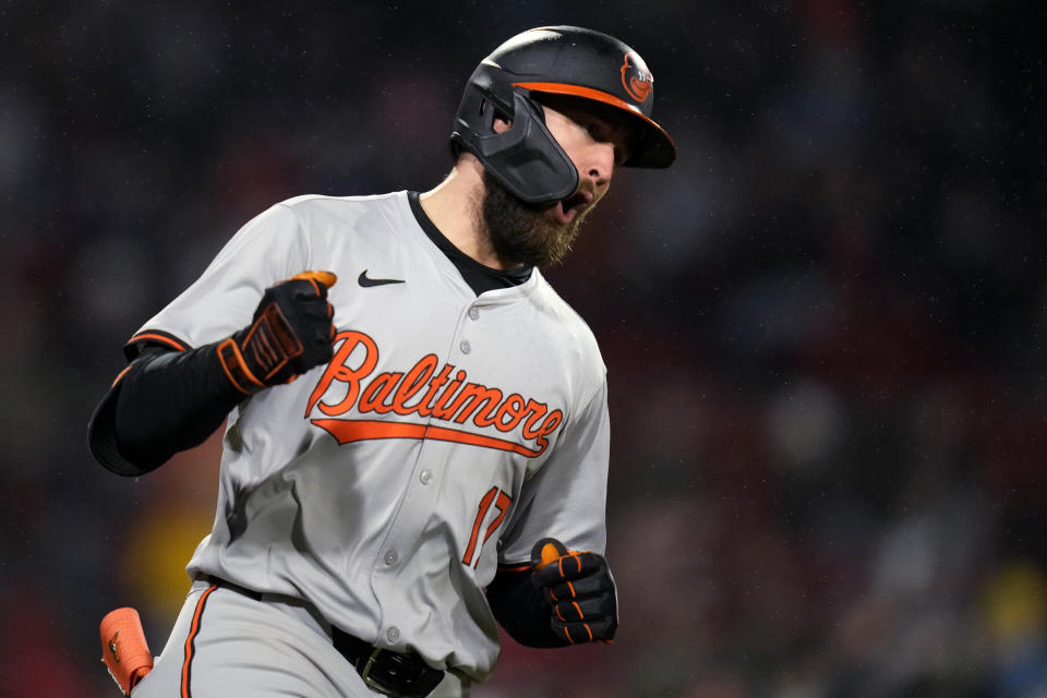 Baltimore Orioles' Colton Cowser pumps his fist while rounding the bases on his solo home run against the Boston Red Sox during the fifth inning of a baseball game Thursday, April 11, 2024, in Boston. (AP Photo/Charles Krupa)