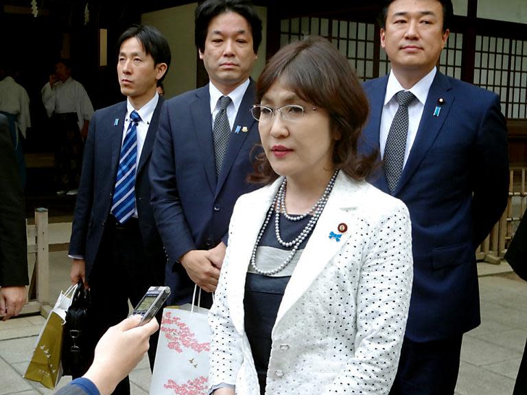 Party policy chief Tomomi Inada speaks to reporters after she visited the controversial Yasukuni Shrine to honour the war dead on April 28, 2014 in Tokyo