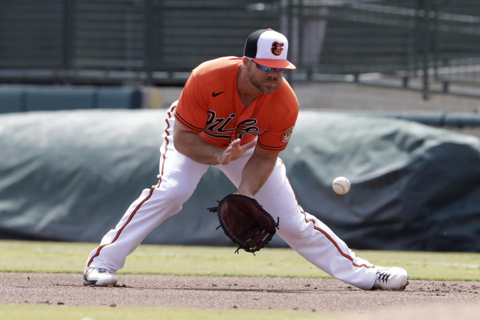 Baltimore Orioles first baseman Chris Davis fields a ground ball from Tampa Bay Rays' Michael Perez in the first inning of a spring training baseball game Monday, March 2, 2020, in Sarasota, Fla. (AP Photo/John Bazemore)