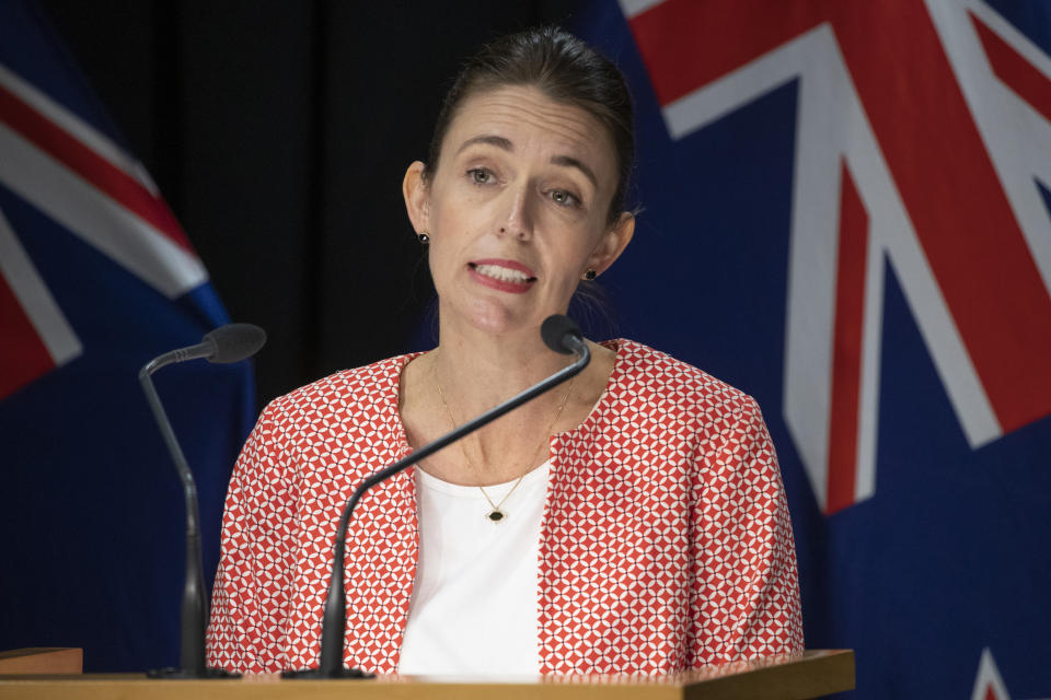 New Zealand Prime Minister Jacinda Ardern announces the country will move to a COVID red traffic light setting during a press conference. Source: Mark Mitchell/NZME via AP