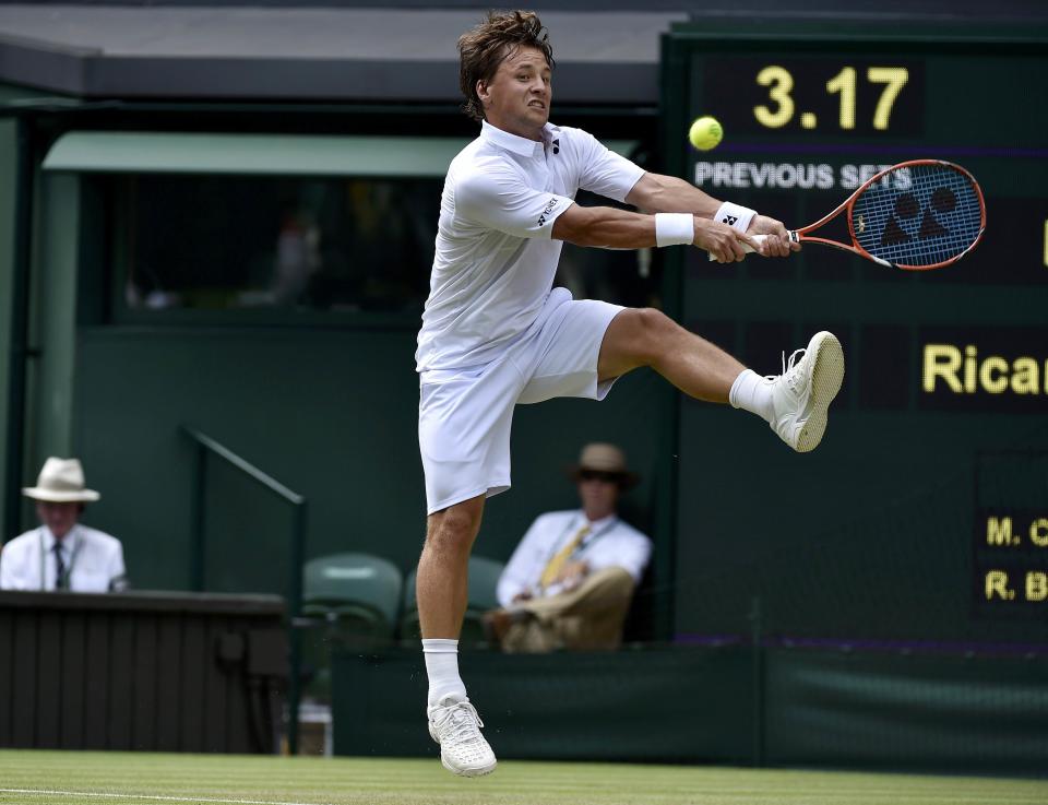 Ricardas Berankis of Lithuania hits a shot during his match against Marin Cilic of Croatia at the Wimbledon Tennis Championships in London, July 1, 2015. REUTERS/Toby Melville