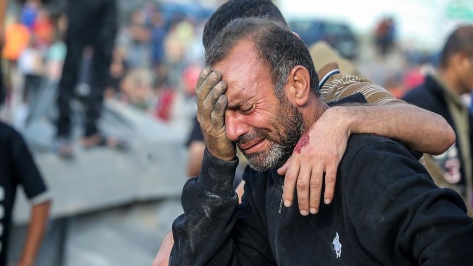 A man cries because his home was bombed during Israeli raids in the southern Gaza Strip on 16 October 2023 in Khan Younis,