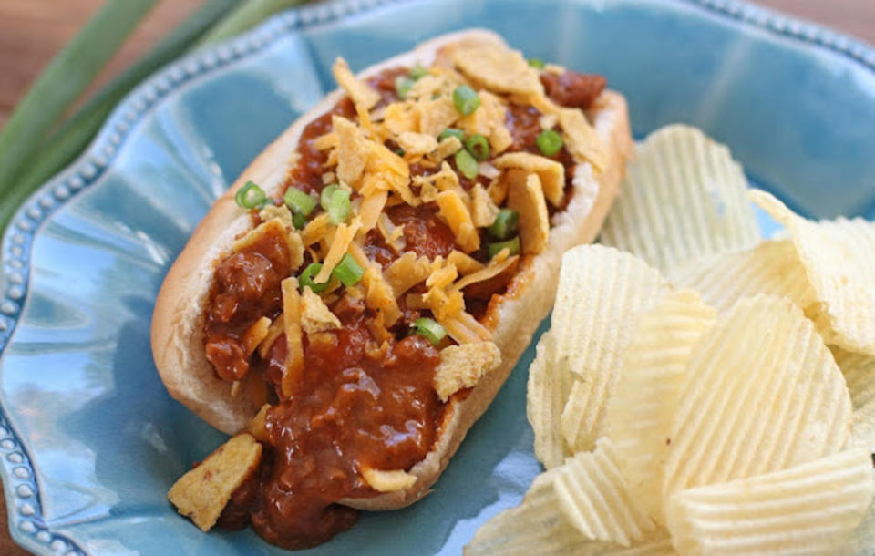 <p>Served Up With Love</p><p>This stadium classic can easily be made at home.</p><p><strong>Get the recipe: <a href="https://www.servedupwithlove.com/2016/11/crock-pot-chili-cheese-dogs.html" rel="nofollow noopener" target="_blank" data-ylk="slk:Crock Pot Chili Cheese Dogs;elm:context_link;itc:0;sec:content-canvas" class="link ">Crock Pot Chili Cheese Dogs</a></strong></p>