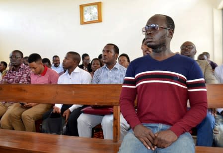 Tanzanian investigative journalist Erick Kabendera sits inside the Kisutu Residents Magistrate Court in Dar es Salaam