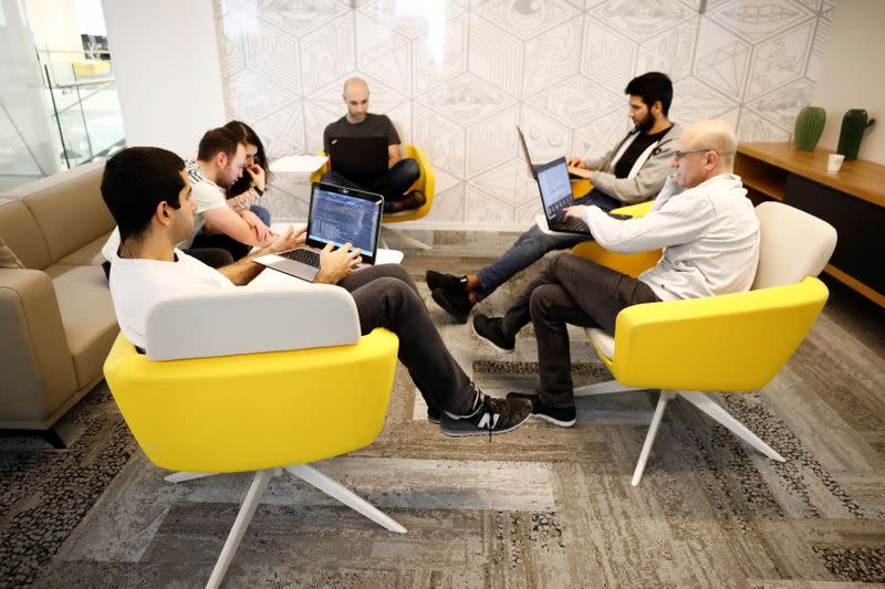 Employees work at U.S. chipmaker Intel Corp's "smart building" in Petah Tikva, near Tel Aviv