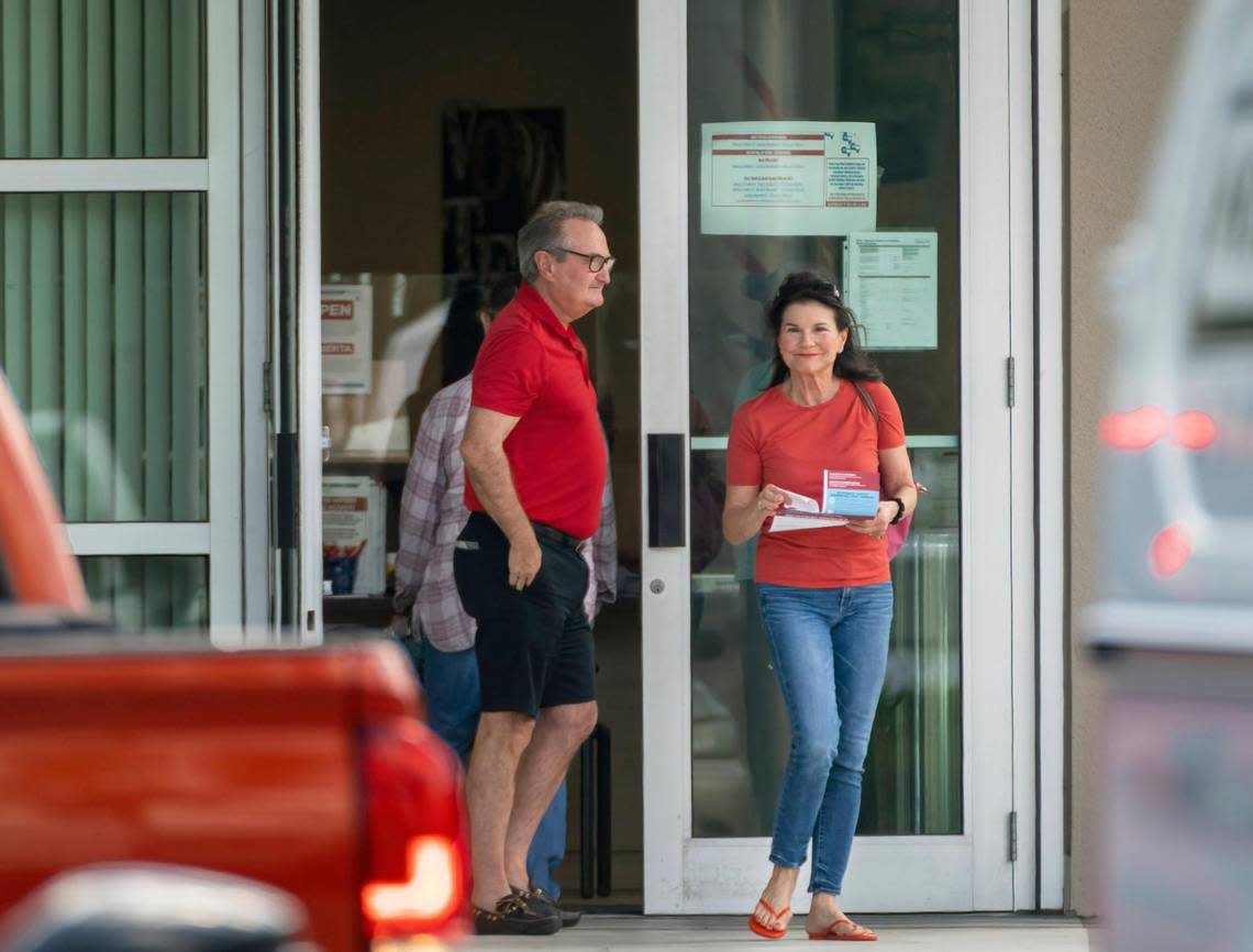 FILE - Voters exit the polls after casting their ballots on the first day of early voting at the Supervisor of Elections Main Office in West Palm Beach, Fla., on Oct. 24, 2022. Election officials in some Florida counties urged people to vote early Sunday, Nov. 6, where possible as a potential tropical system threatens the state on Election Day. The Palm Beach County elections supervisor, Wendy Sartory Link, said voters who want to avoid weather-related disruptions should cast their ballots by 7 p.m. Sunday. (Greg Lovett/The Palm Beach Post via AP, File) Greg Lovett/AP