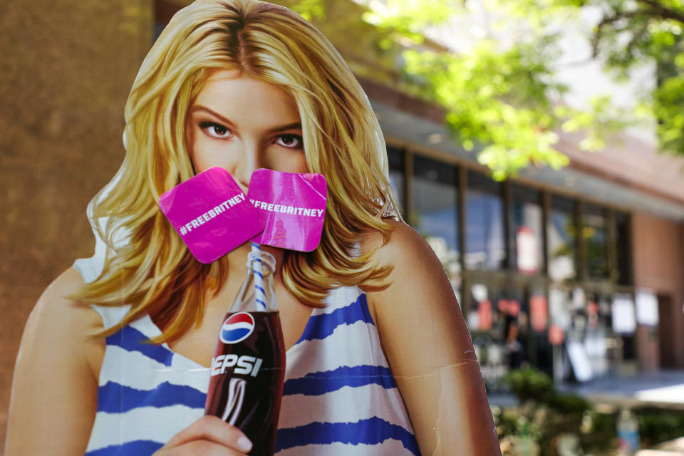 LOS ANGELES, CALIFORNIA - JUNE 23: A cardboard cutout depicting Britney Spears is seen during a #FreeBritney protest at Los Angeles Grand Park during a conservatorship hearing for Spears on June 23, 2021 in Los Angeles, California. Spears is expected to address the court remotely. Spears was placed in a conservatorship managed by her father, Jamie Spears, and an attorney, which controls her assets and business dealings, following her involuntary hospitalization for mental care in 2008. (Photo by Rich Fury/Getty Images)