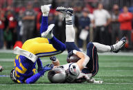 <p>Rex Burkhead #34 of the New England Patriots is tackled by Nickell Robey-Coleman #23 of the Los Angeles Rams during Super Bowl LIII at Mercedes-Benz Stadium on February 3, 2019 in Atlanta, Georgia. (Photo by Harry How/Getty Images) </p>