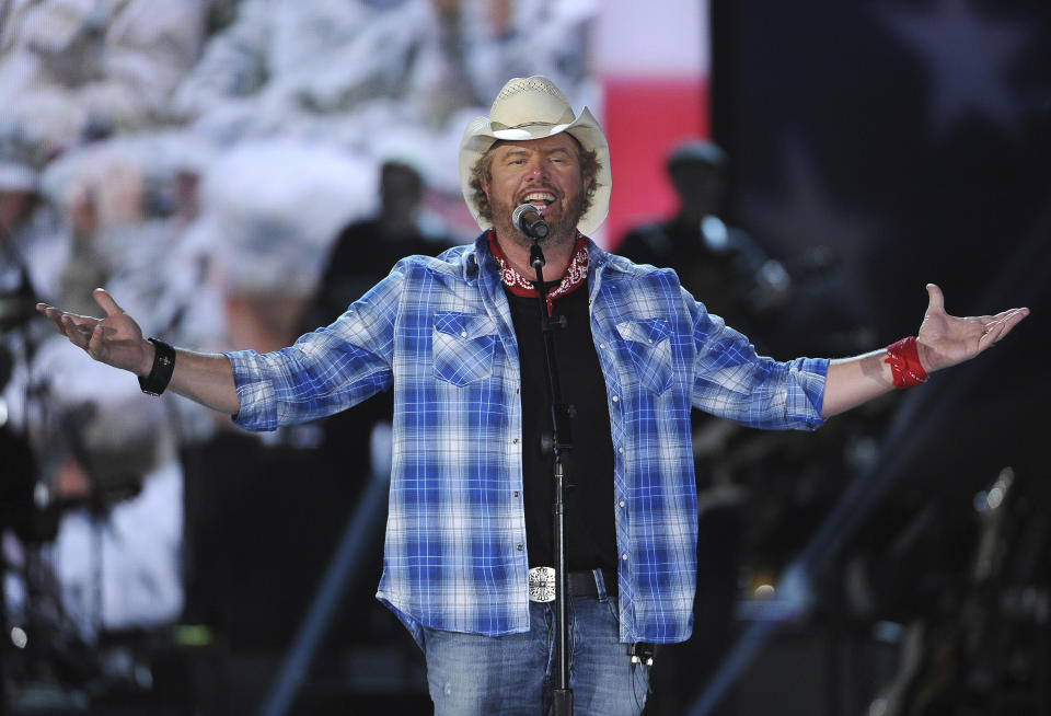 FILE - In this April 7, 2014, file photo shows Toby Keith performs at ACM Presents an All-Star Salute to the Troops in Las Vegas. “Beer For My Horses” singer-songwriter Toby Keith has died. He was 62. Keith passed peacefully on Monday, Feb. 5, 2024 surrounded by his family, according to a statement posted on the country singer's website.(Photo by Chris Pizzello/Invision/AP, File)