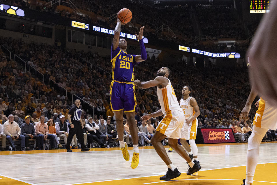 LSU forward Derek Fountain (20) shoots next to Tennessee guard Josiah-Jordan James (30) during the second half of an NCAA college basketball game Wednesday, Feb. 7, 2024, in Knoxville, Tenn. (AP Photo/Wade Payne)