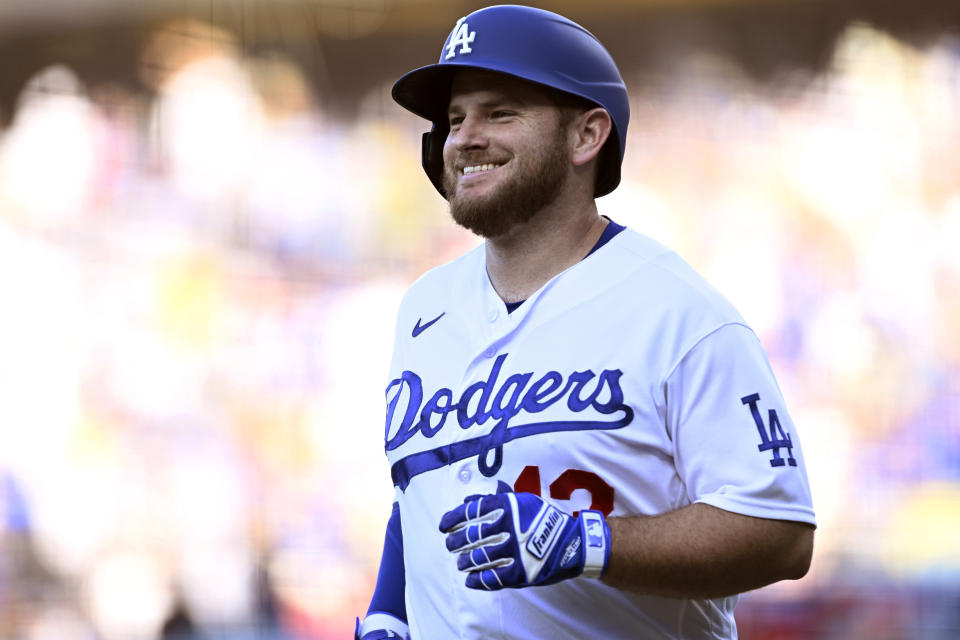 Los Angeles Dodgers' Max Muncy smiles after hitting a two-run home run against the Cincinnati Reds during the first inning of a baseball game in Los Angeles, Saturday, July 29, 2023. (AP Photo/Alex Gallardo)