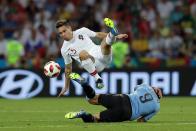 <p>Luis Suarez takes cover as Portugal’s Raphael Guerreiro takes noprisoners </p>