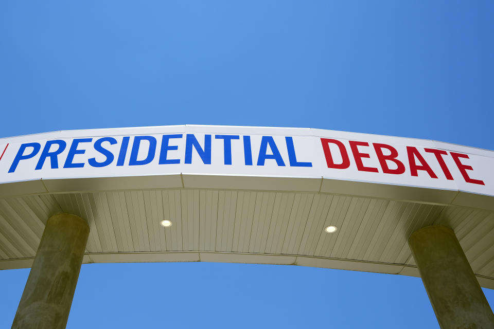 Signage for the upcoming presidential debate is seen at the media file center near the CNN Techwood campus in Atlanta on Tuesday, June 25, 2024. A new poll finds that most U.S. adults plan to watch or listen to some element of Thursday's presidential debate. (AP Photo/Pablo Martinez Monsivais)