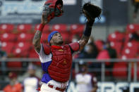 Puerto Rico's Yadier Molina reacts after tagging out Venezuela's Ali Castillo during the first inning of a Caribbean Series baseball game at Teodoro Mariscal Stadium in Mazatlan, Mexico, Monday, Feb. 1, 2021. (AP Photo/Moises Castillo)