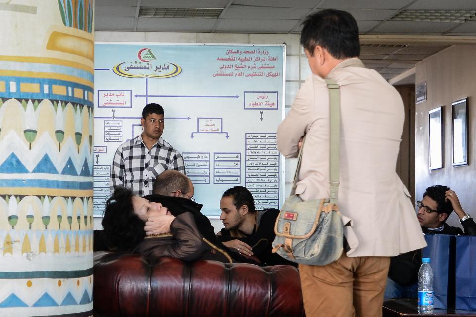 A South Korean woman, left, rests in a hospital waiting room as those wounded in a deadly explosion Sunday near the Egyptian border crossing with Israel at Taba, are treated at a hospital in Sharm el Sheikh, Egypt, Monday, Feb. 17, 2014. An explosion tore through a bus filled with South Korean sightseers in the Sinai Peninsula on Sunday, killing at least four people and raising fears that Islamic militants have renewed a bloody campaign to wreck Egypt’s tourism industry. (AP Photo)