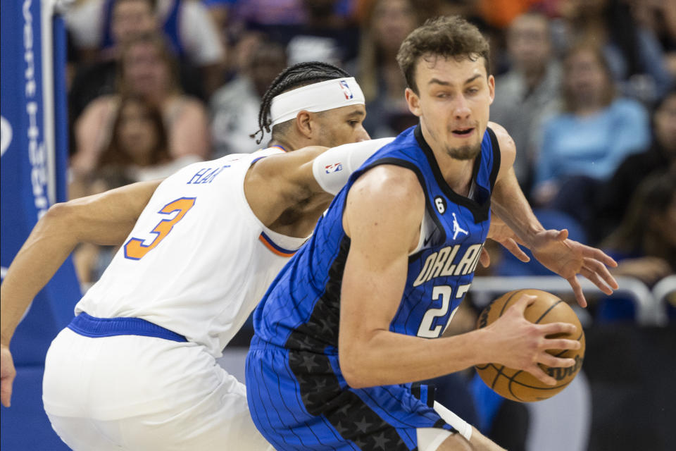 Orlando Magic forward Franz Wagner drives to basket against New York Knicks guard Josh Hart (3) during the first half of an NBA basketball game, Thursday, March 23, 2023, in Orlando, Fla. (AP Photo/Kevin Kolczynski)