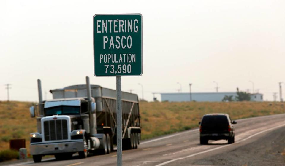 A sign on Glade Road North displays the population to drivers traveling south into the Pasco city limits from rural Franklin County.