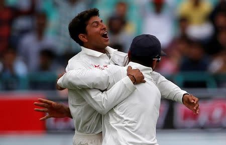 Cricket - India v Australia - Fourth Test cricket match - Himachal Pradesh Cricket Association Stadium, Dharamsala, India - 25/03/17 - India's Kuldeep Yadav and Murali Vijay celebrate the dismissal of Australia's Peter Handscomb. REUTERS/Adnan Abidihandscomb