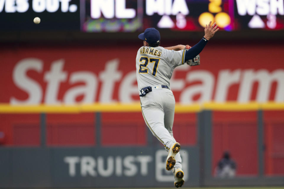 Milwaukee Brewers' Willy Adames misses an infield pop fly during the second inning of a baseball game against the Atlanta Braves, Saturday, July 31, 2021, in Atlanta. (AP Photo/Hakim Wright Sr.)