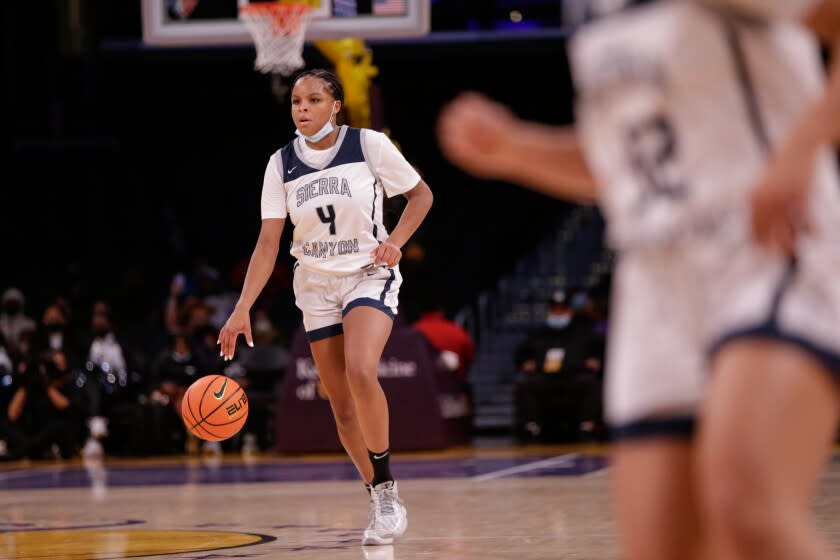 LOS ANGELES, CA - DECEMBER 04: MacKenly Randolph (4) of Sierra Canyon brings the ball up.