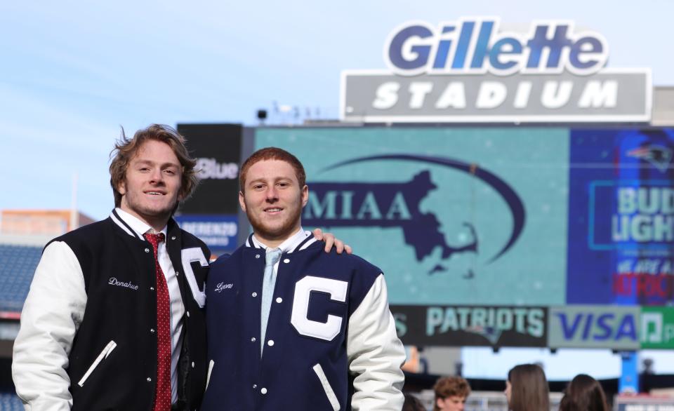 Cohasset High football captains Michael Donahue, left, and Jackie Lyons participate in the MIAA state championship breakfast at Gillette Stadium on Tuesday, Nov. 23, 2021.