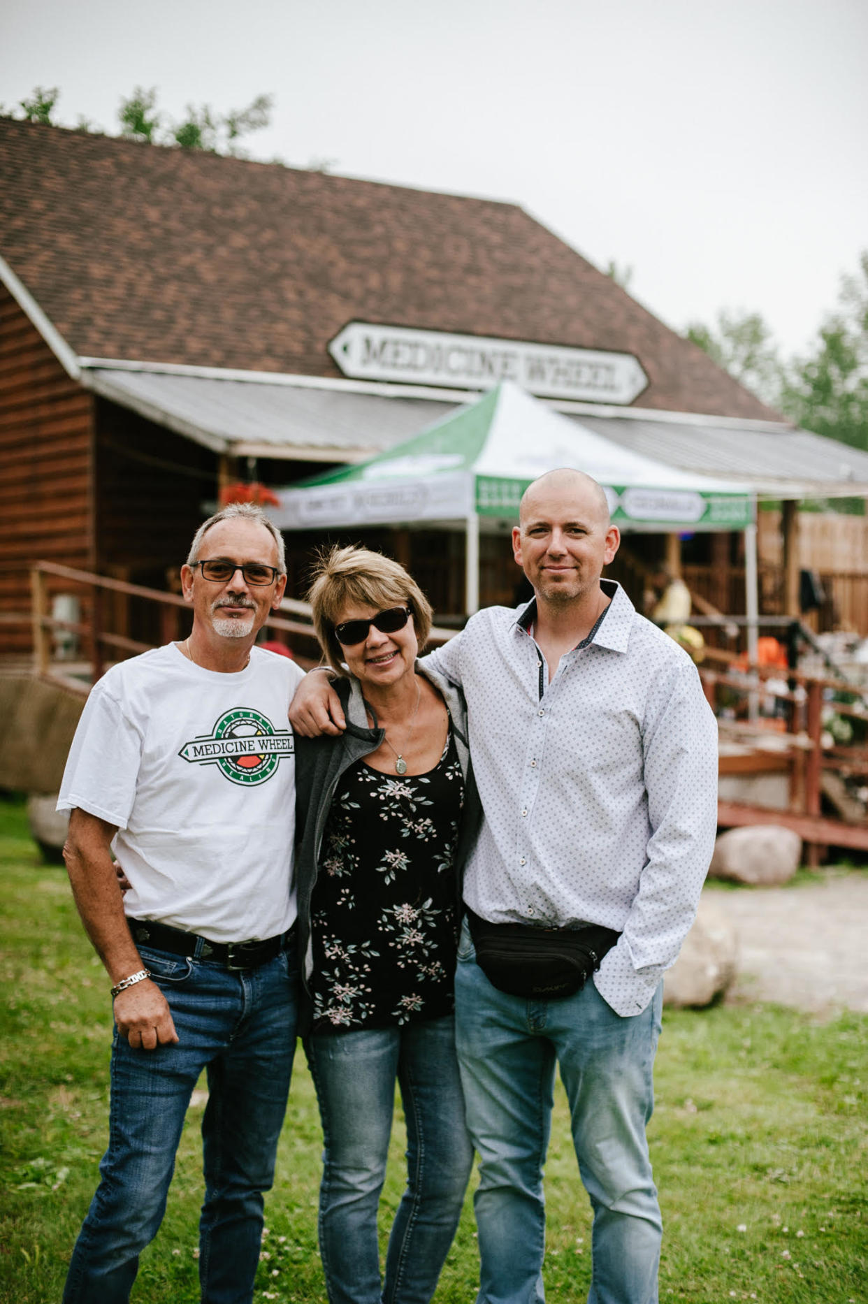 Rob Stevenson and his parents, Glen and Charlene, stand in front of their Indigenous-owned and operated cannabis store on the Alderville First Nation. (Provided)
