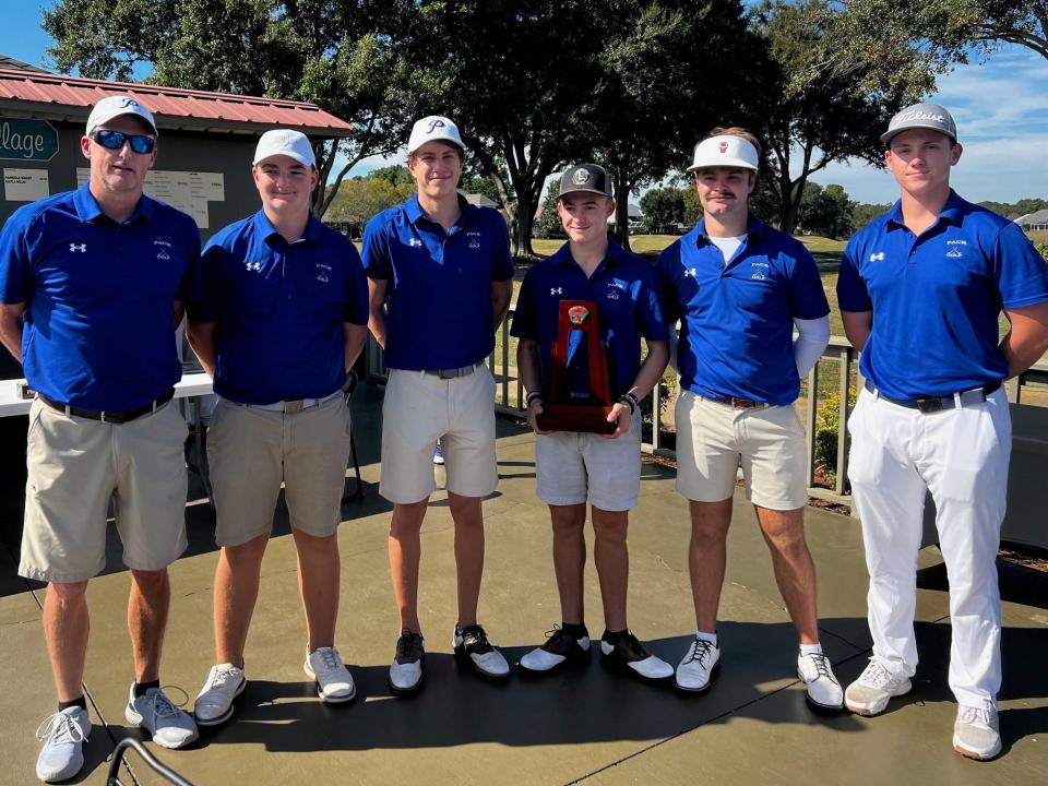 The Pace boys golf team celebrates its fourth-straight district title after winning the District 1-3A meet on Monday, Oct. 23 from the Stonebrook Golf Club.