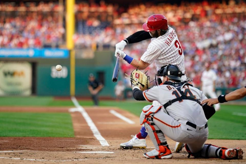 Philadelphia Phillies' Bryce Harper hits a run-scoring single against San Francisco Giants pitcher Scott Alexander during the first inning of a baseball game, Monday, Aug. 21, 2023, in Philadelphia.