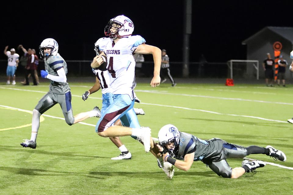 SeaWolves defensive back Liam O'Connor makes a touchdown saving tackle on North Country's Cooper Wheeler during Burlington/South Burlington's 34-22 loss to the Falcons on Friday night at SBHS.