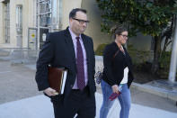 Former Los Angeles Angels employee Eric Kay, left, walks out of a federal court building where he is on trial for federal drug distribution and conspiracy charges, in Fort Worth, Texas, Tuesday, Feb. 15, 2022. Kay is accused of providing Tyler Skaggs the drugs that led to the pitcher's overdose death. The 27-year-old Skaggs was found dead in July 2019 in a suburban Dallas hotel room. He had choked to death on his vomit, and a toxic mix of alcohol, fentanyl and oxycodone was in his system. (AP Photo/LM Otero)