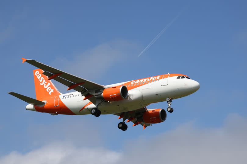 an easyJet branded Airbus A320 in the sky