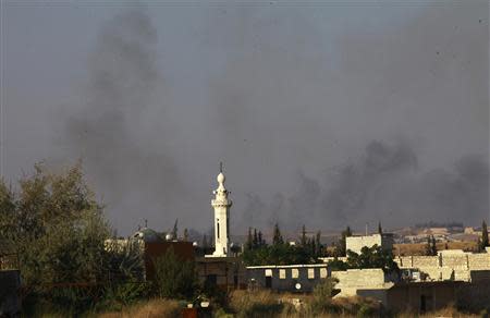 Smoke rises from al-Jazmati area after what activists said was shelling by forces loyal to Syria's President Bashar al-Assad in Aleppo, September 2, 2013. REUTERS/Hamid Khatib