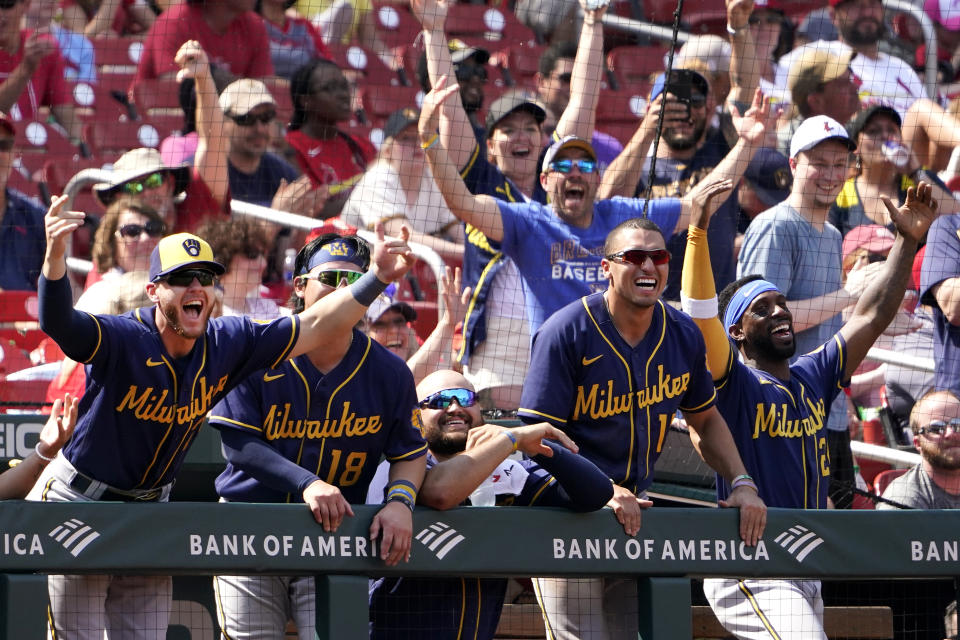 Members of the Milwaukee Brewers celebrate as teammate Lorenzo Cain rounds the bases after hitting a two-run home run during the eighth inning of a baseball game against the St. Louis Cardinals Sunday, May 29, 2022, in St. Louis. (AP Photo/Jeff Roberson)