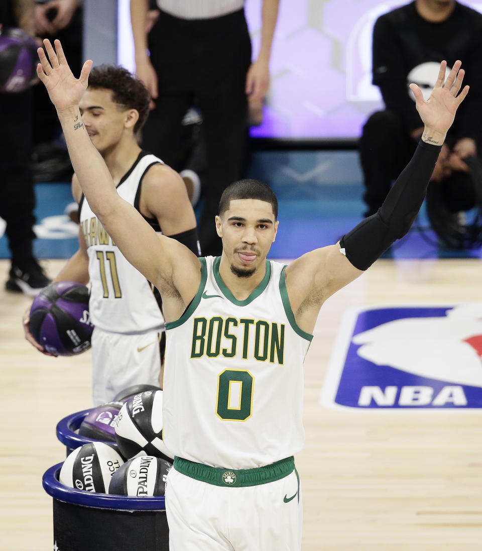 Boston Celtics Jayson Tatum celebrates winning the NBA All-Star skills session basketball contest, Saturday, Feb. 16, 2019, in Charlotte, N.C. (AP Photo/Gerry Broome)