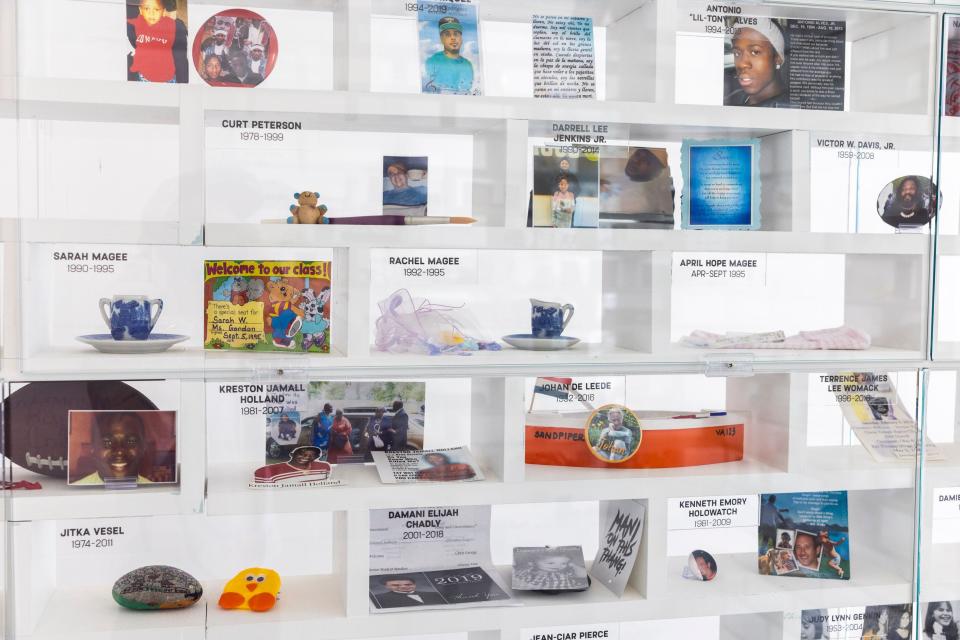 Bricks display the name of gun violence victims and contain items to remember that person. The victims range in age and their deaths were across several decades. These mementos are part of the Gun Violence Memorial Project in Washington D.C., which is collecting donations from communities such as Jackson to memorialize more people.