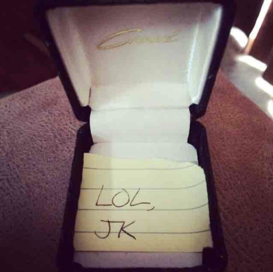 A ring box with a note that says lol jk