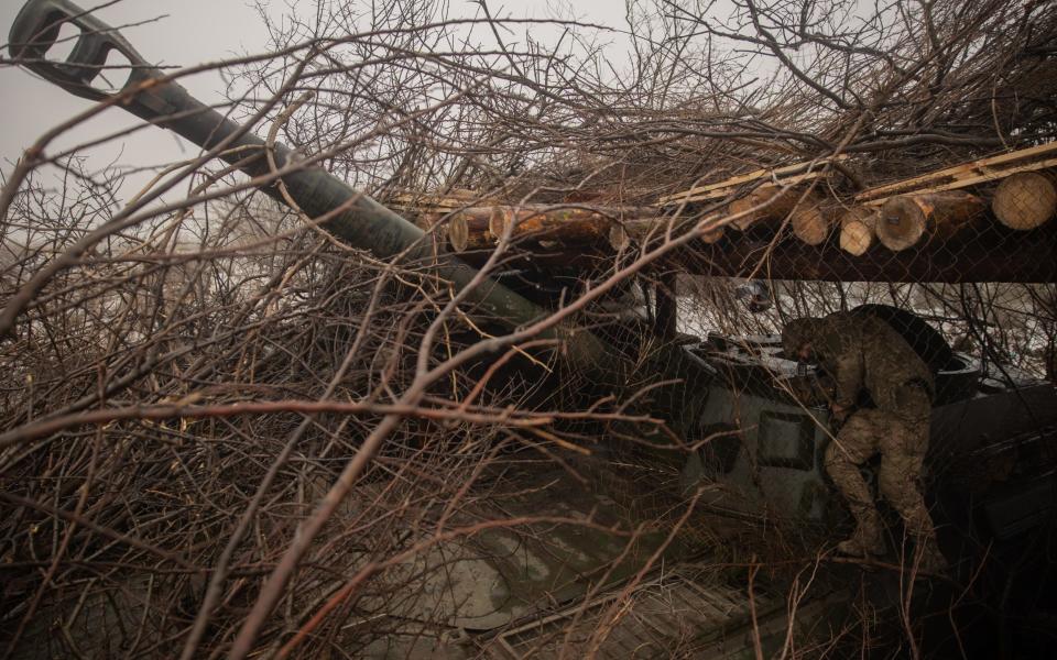 A Ukrainian self-propelled 2S1 Gvozdika artillery gun is camouflaged near Bakhmut