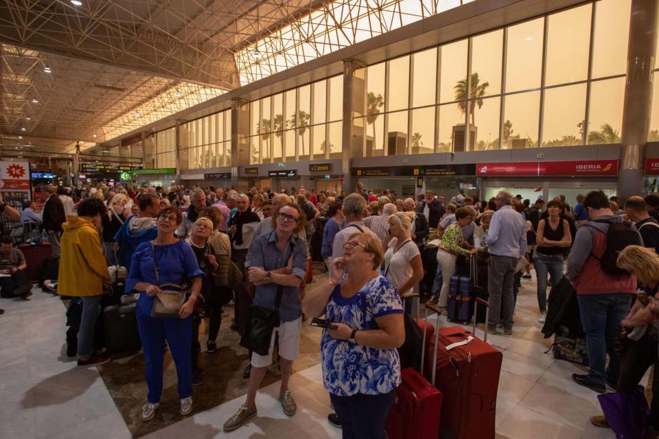 Passengers wait at Tenerife SouthReina Sofia Airport (AFP via Getty Images)