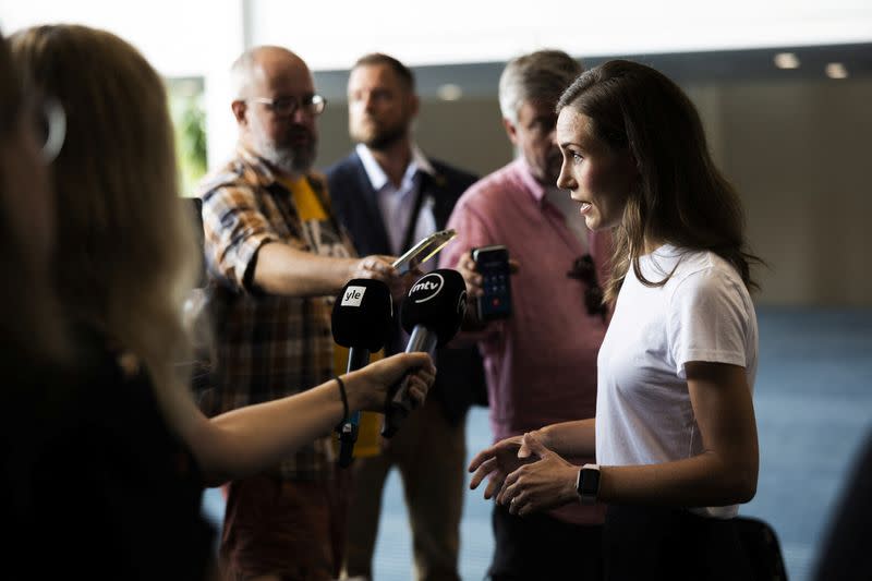 Finland's Prime Minister Sanna Marin speaks with members of the media in Kuopio