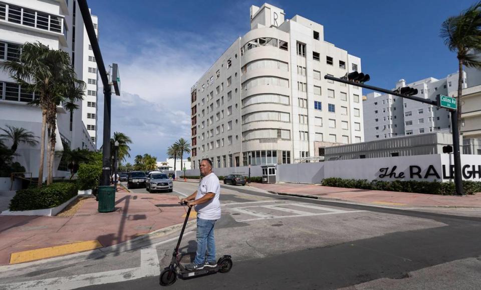 A scooter rider glides by Miami Beach’s historic Raleigh Hotel, which has been gutted and awaiting restoration under a $500 million plan by developer Michael Shvo. The plan includes renovation of a pair of abutting Art Deco hotels and the addition of a luxury condo tower behind them.