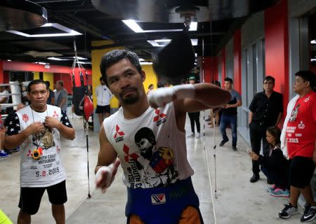 Senator and boxing champion Manny "Pacman" Pacquiao practice on a speed ball inside the Elorde gym in Pasay city, metro Manila, Philippines September 28, 2016 in preparation for his upcoming bout with Jessie Vargas next month in Las Vegas, U.S.A. Picture taken September 28, 2016. REUTERS/Romeo Ranoco