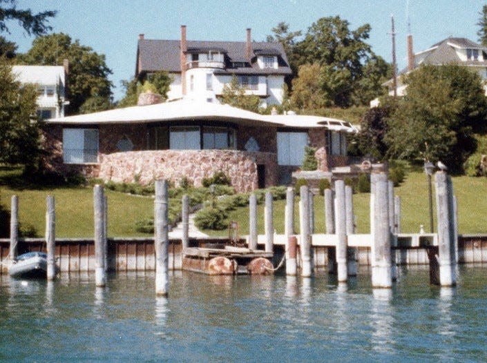 Round Lake façade of Earl Young Thistle Downs Lane house.