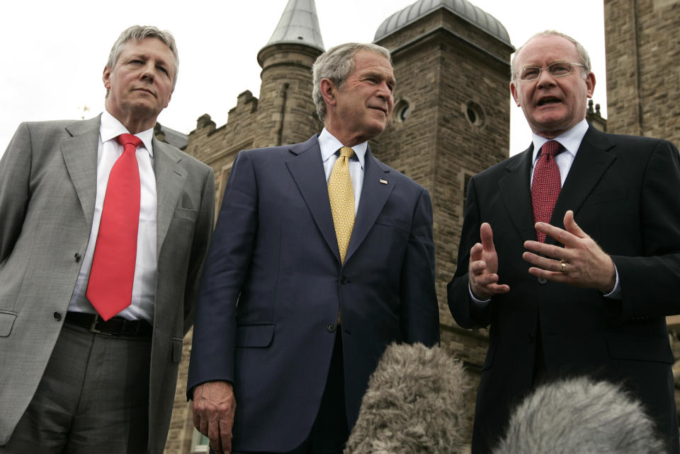 FILE - This is a Monday, June 16, 2008 file photo of U.S. President George W. Bush, center, First Minister of Northern Ireland Peter Robinson, left, and Deputy First Minister of Northern Ireland Martin McGuinness, right, as they speak to reporters at Stormont Castle in Belfast. McGuinness, an IRA and Sinn Fein leader who became a minister of peacetime Northern Ireland, has died, according to UK media Tuesday, March 21, 2017. (AP Photo/Evan Vucci, File)