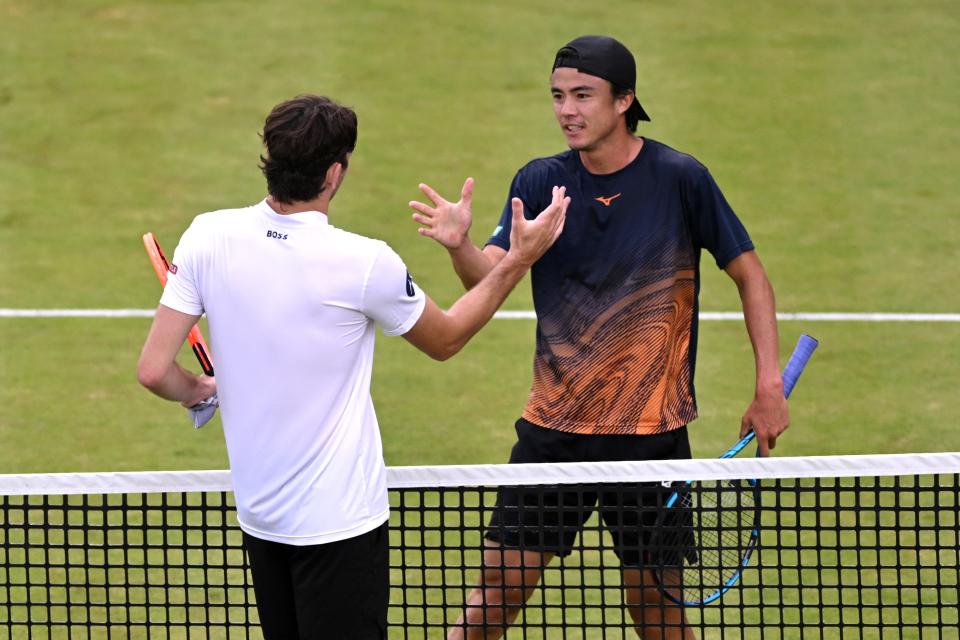 Taylor Fritz, left, is congratulated by Taro Daniel (Getty Images)