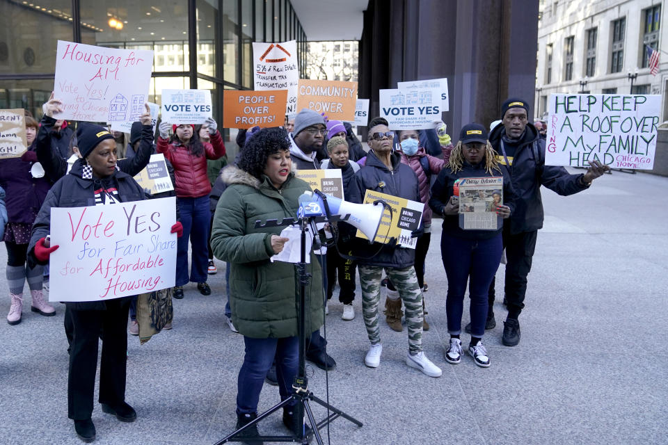 FILE - Supporters of a Chicago ballot measure that raises a one-time tax on luxury properties to fund services for homeless people rally prior to a court hearing, Feb. 14, 2024, in Chicago. The ballot will be on the March 19 primary ballot, a panel of Illinois appeals court judges ruled Wednesday, March 6. (AP Photo/Charles Rex Arbogast, File)