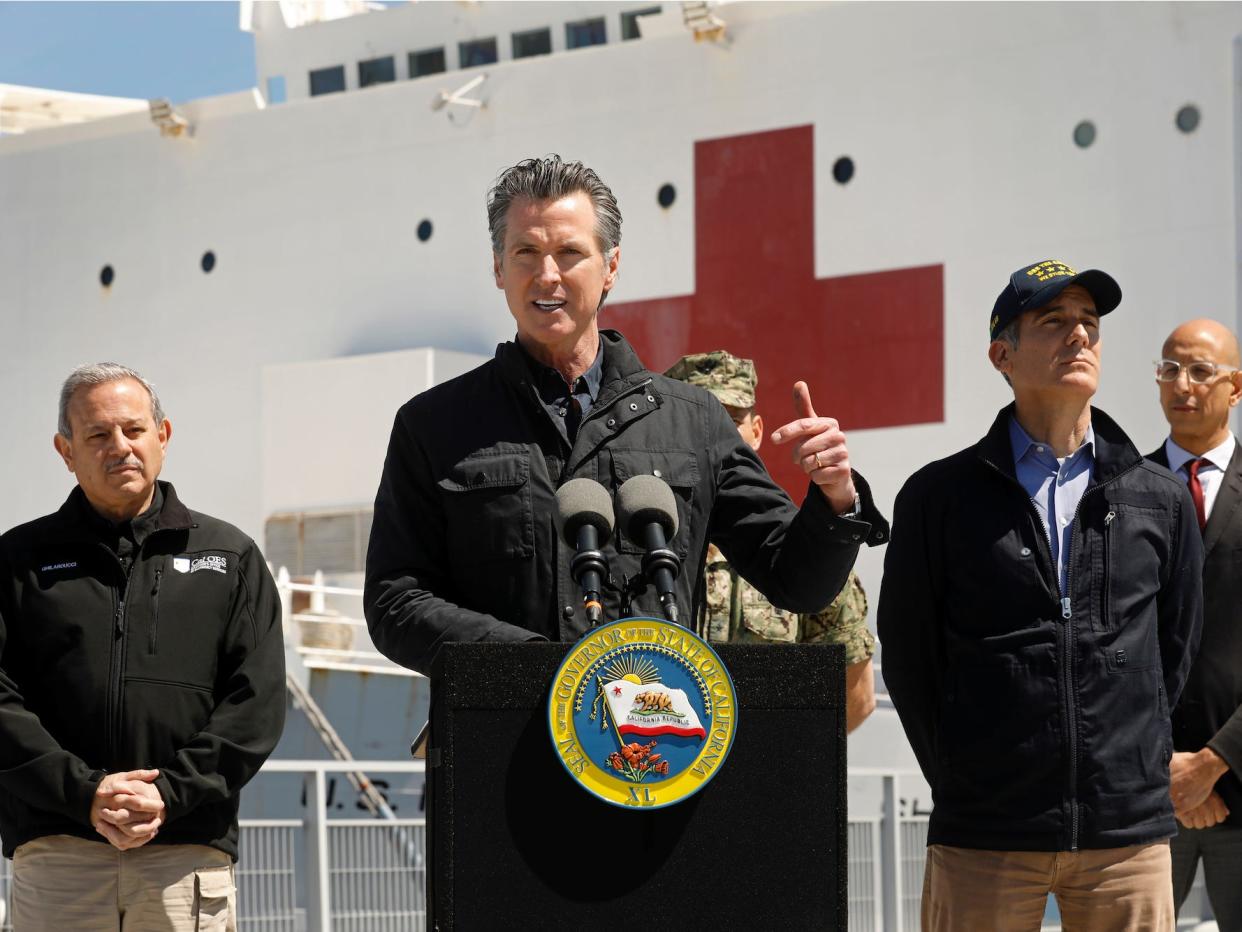 California Governor Gavin Newsom speaks in front of the hospital ship USNS Mercy that arrived into the Port of Los Angeles on March 27.