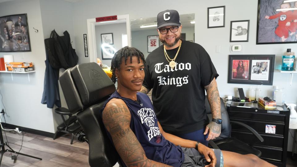 Farleigh Dickinson forward Sean Moore and his tattoo artist, T King, worked on a distinct set of Columbus icons on Moore's right arm: the Columbus Dispatch nameplate; an I-270 highway sign, and three jerseys including one representing Reynoldsburg High School.