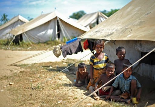 Muslim Rohingya children are seen at the Bawdupha camp for internally displaced people on the outskirts of Sittwe, the capital of Myanmar's western Rakhine state, on November 2. The world's top Islamic body called Saturday for the international community to protect Muslims in Myanmar's unrest-hit Rakhine state from "genocide" as US President Barack Obama readied for a landmark trip to the country